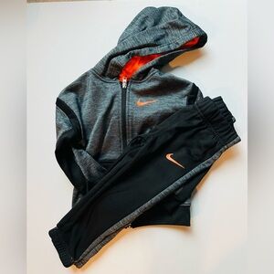 Nike Charcoal and Black Tracksuit with Bright Orange Highlights